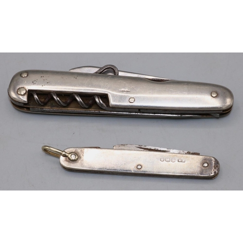 152 - Silver pocket knife with folding blade, hallmarks are rubbed, L9.5cm, another smaller pocket knife, ... 