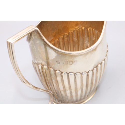 160 - Late Victorian Silver milk jug, part lobed with a angled sweeping handle, London, 1896, Charles Stua... 