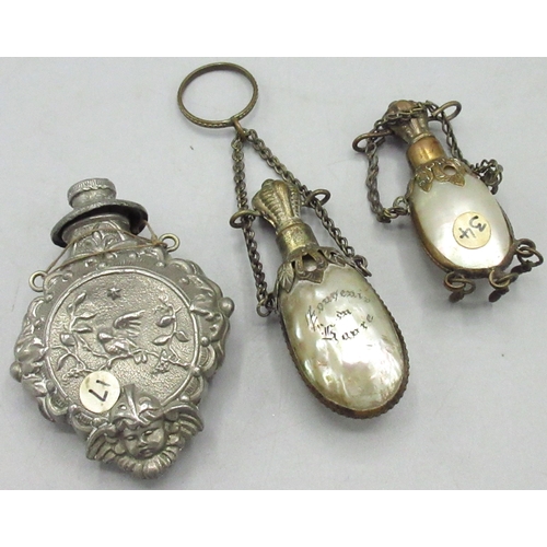 103 - Three scent bottles with chatelaine mounts, comprising two with mother of pearl shell bodies, one ma... 