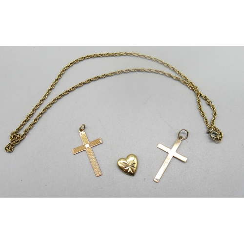 191 - Two 9ct yellow gold crucifix pendants, a 9ct gold heart pendant, all stamped 9k, and a 9ct yellow go... 