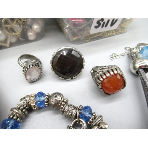 49 - Pewter ring set with smokey quartz, two other white metal rings, and a collection of costume jewelle... 