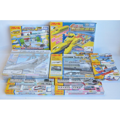 1300 - Collection of boxed Japanese Imported Takara Tomy battery operated plastic model train sets to inclu... 