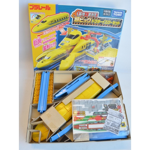 1300 - Collection of boxed Japanese Imported Takara Tomy battery operated plastic model train sets to inclu... 