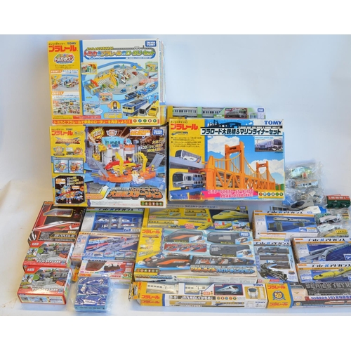 1314 - Collection of Takara Tomy battery powered plastic model train sets to include trains packs, layout s... 