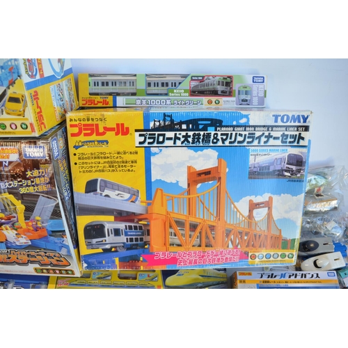 1314 - Collection of Takara Tomy battery powered plastic model train sets to include trains packs, layout s... 