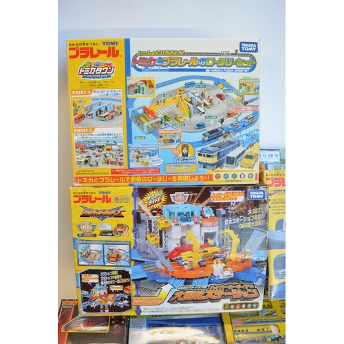 1314 - Collection of Takara Tomy battery powered plastic model train sets to include trains packs, layout s... 