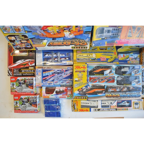 1314 - Collection of Takara Tomy battery powered plastic model train sets to include trains packs, layout s... 