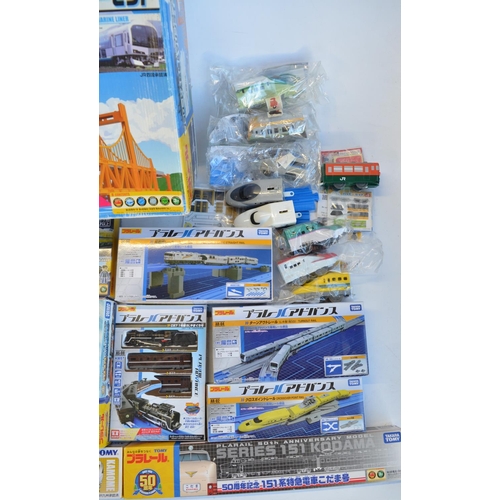 1314 - Collection of Takara Tomy battery powered plastic model train sets to include trains packs, layout s... 