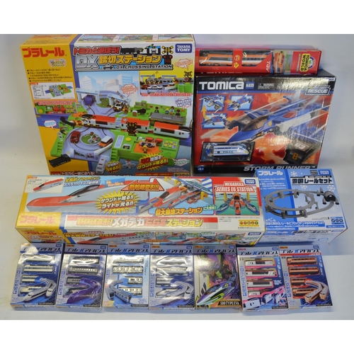 1315 - Collection of Takara Tomy battery powered plastic model train sets to include trains packs, layout s... 