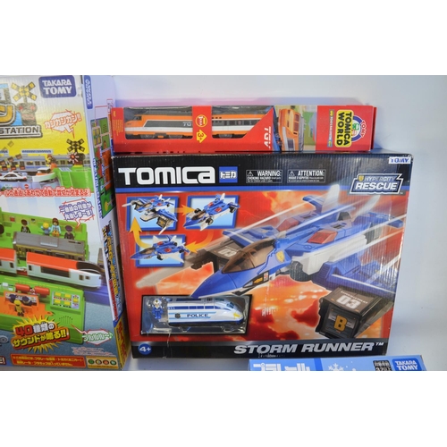 1315 - Collection of Takara Tomy battery powered plastic model train sets to include trains packs, layout s... 