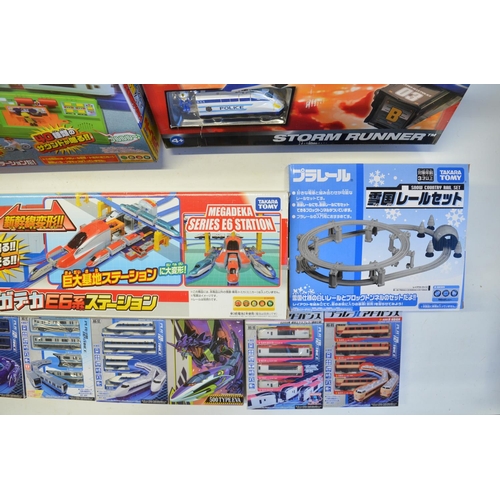 1315 - Collection of Takara Tomy battery powered plastic model train sets to include trains packs, layout s... 