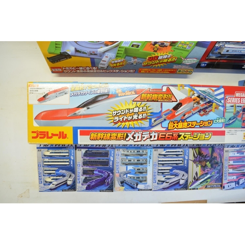 1315 - Collection of Takara Tomy battery powered plastic model train sets to include trains packs, layout s... 