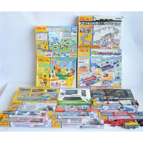 1316 - Collection of Tomy and Takara Tomy battery powered plastic model train sets to include trains packs,... 