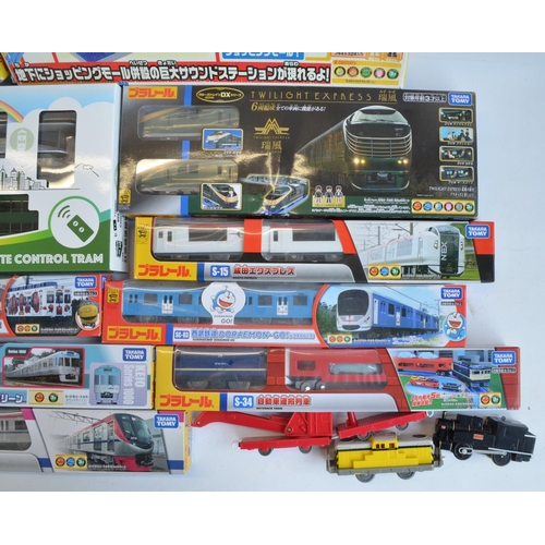 1316 - Collection of Tomy and Takara Tomy battery powered plastic model train sets to include trains packs,... 