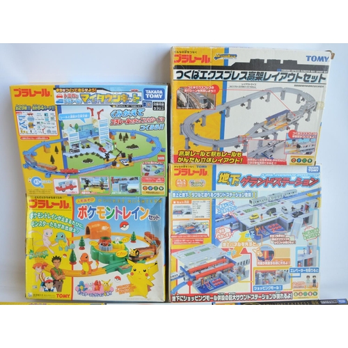 1316 - Collection of Tomy and Takara Tomy battery powered plastic model train sets to include trains packs,... 