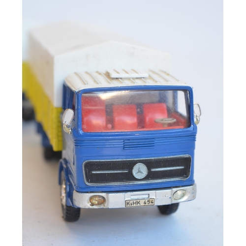 10 - Three vintage Dinky Toys diecast model vehicles to include 917 Mercedes-Benz Truck And Trailer (mode... 
