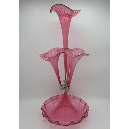 1171 - Victorian style cranberry glass epergne with four flutes on a scalloped edged circular base, H53cm