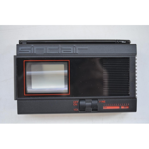 1194 - Sinclair flat screen pocket television in as new unused condition, complete with instructions, an un... 