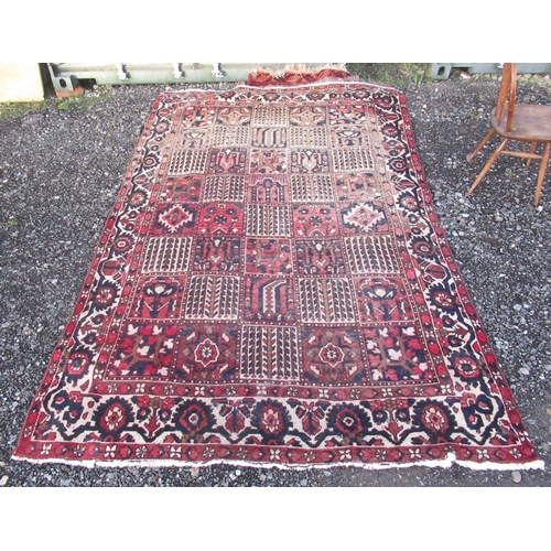 1212 - Caucasian multicoloured bordered rug, the field with alternating geometric and hooked striped square... 