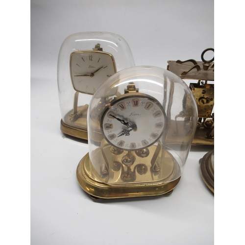 222 - Kundo C20th brass four glass 400 day suspension timepiece H23cm eight other similar clocks by Kern, ... 