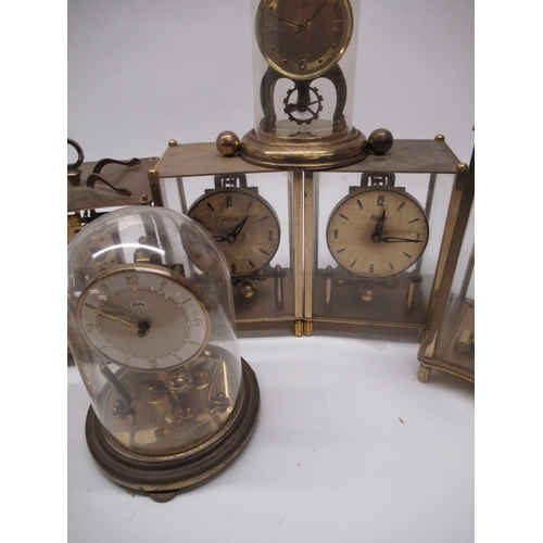 222 - Kundo C20th brass four glass 400 day suspension timepiece H23cm eight other similar clocks by Kern, ... 