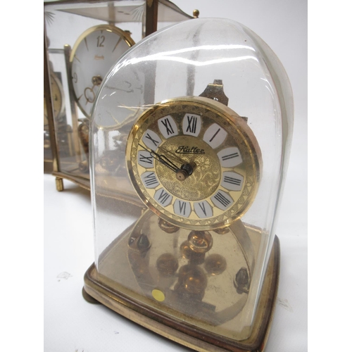 222 - Kundo C20th brass four glass 400 day suspension timepiece H23cm eight other similar clocks by Kern, ... 