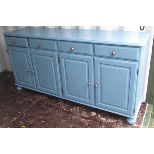 1051 - Blue finish dresser, with four drawers above four panel doors with faceted metal ball handles, on bu... 