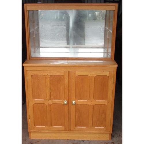 1223 - Yorkshire oak style light oak side cabinet, raised single shelf back with two glazed doors above a p... 