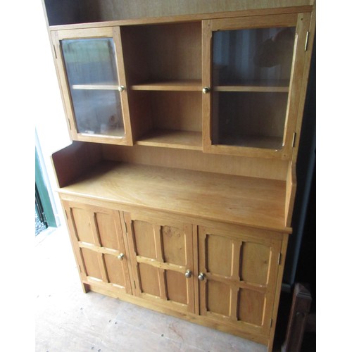 1225 - Yorkshire oak style light oak dresser, raised three shelf back with two glazed doors, the base with ... 