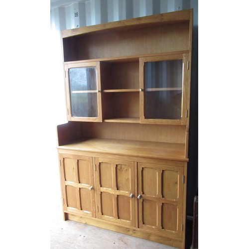 1225 - Yorkshire oak style light oak dresser, raised three shelf back with two glazed doors, the base with ... 