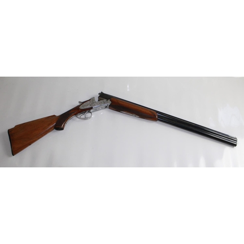 485 - Armitalia 12bore Over/under ejector Shotgun with double trigger. Nice engraving to lock. Barrel leng... 