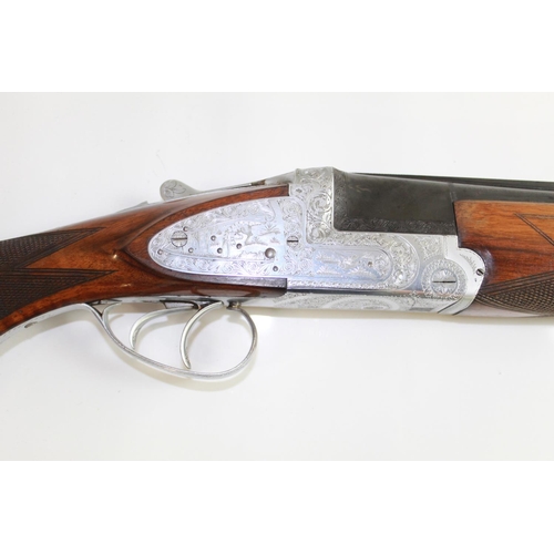 485 - Armitalia 12bore Over/under ejector Shotgun with double trigger. Nice engraving to lock. Barrel leng... 