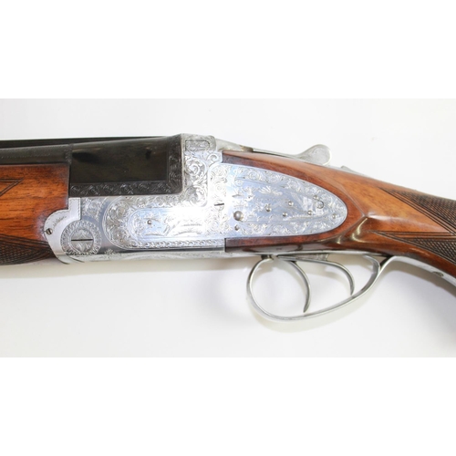 485 - Armitalia 12bore Over/under ejector Shotgun with double trigger. Nice engraving to lock. Barrel leng... 