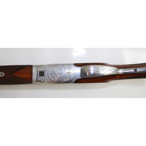 485 - Armitalia 12bore Over/under ejector Shotgun with double trigger. Nice engraving to lock. Barrel leng... 