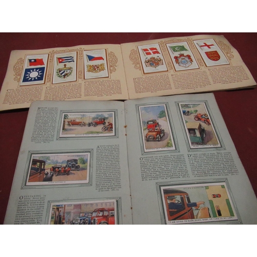 375 - Twelve cigarette card albums, loose cigarette cards of players, other post war collectors cards, 'Po... 