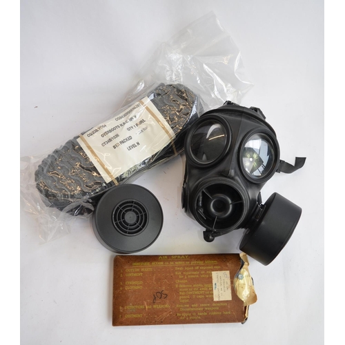 374 - An ex-British Army Avon 1990 twin port gas respirator with 2 cartridges (appears unused), a set of N... 