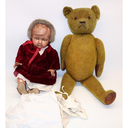 1224 - Large yellow plush teddy bear, with leather arm and footpads and brown glass eyes, H73cm, and a cell... 