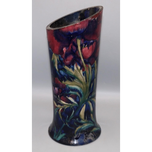 322 - Moorcroft Pottery: cut down vase, with red flowers on dark blue ground, H34cm, A/F