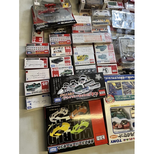 1290 - Collection of Takara Tomy Japanese import vehicle playsets, boxed vehicles, etc. (qty)