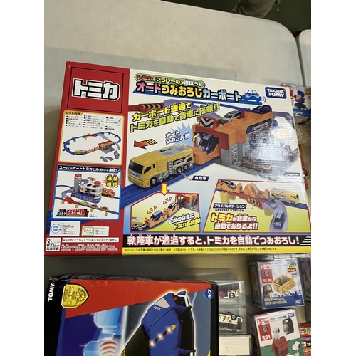 1290 - Collection of Takara Tomy Japanese import vehicle playsets, boxed vehicles, etc. (qty)