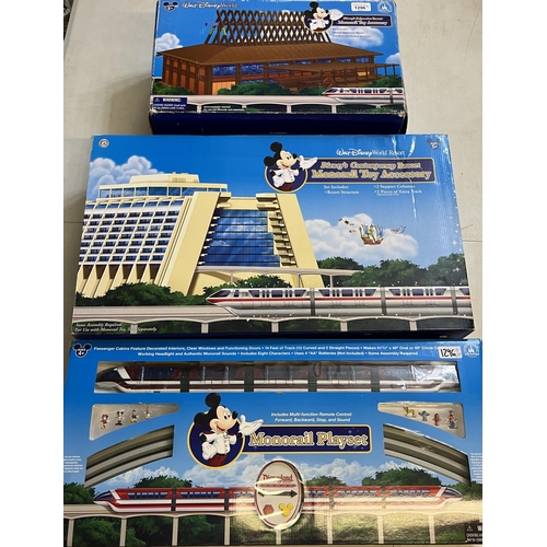 1296 - Walt Disney World Resort Monorail playset and two monorail toy accessories, all boxed