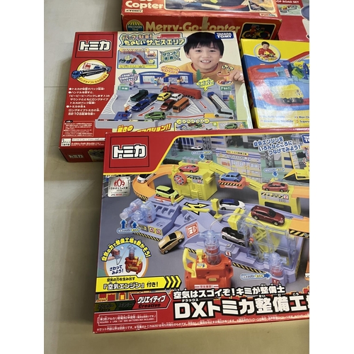 1299 - Collection of boxed Takara Tomy Japanese import vehicle play sets, and a Discovery Time Merry-Go-Cop... 