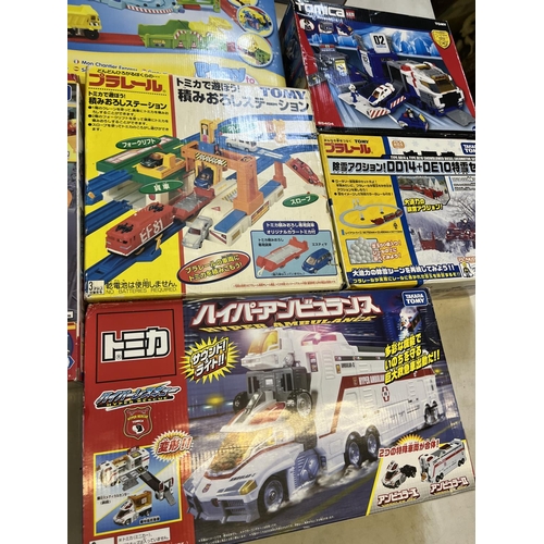 1299 - Collection of boxed Takara Tomy Japanese import vehicle play sets, and a Discovery Time Merry-Go-Cop... 