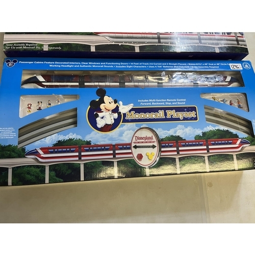 1296 - Walt Disney World Resort Monorail playset and two monorail toy accessories, all boxed