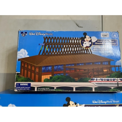 1296 - Walt Disney World Resort Monorail playset and two monorail toy accessories, all boxed