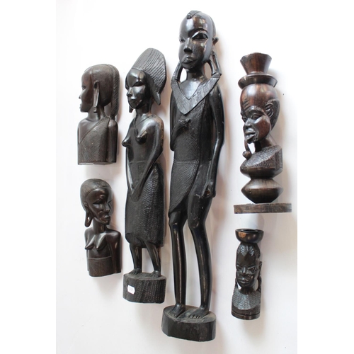 1359 - Two large tribal figures of husband and wife, pair of well carved ebony bookends and two single cand... 