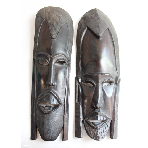 1362 - Pair of hand carved barley twist hardwood walking canes, one A/F, and two Kenyan carved wood tribal ... 