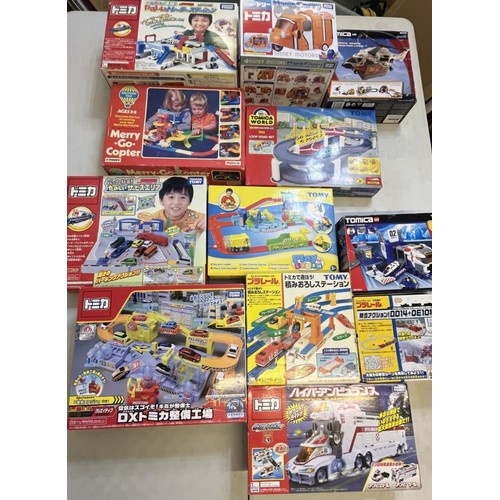 1299 - Collection of boxed Takara Tomy Japanese import vehicle play sets, and a Discovery Time Merry-Go-Cop... 