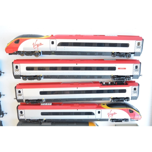 129 - Collection of unboxed OO gauge railway models to include Hornby Virgin HST with power and dummy cars... 