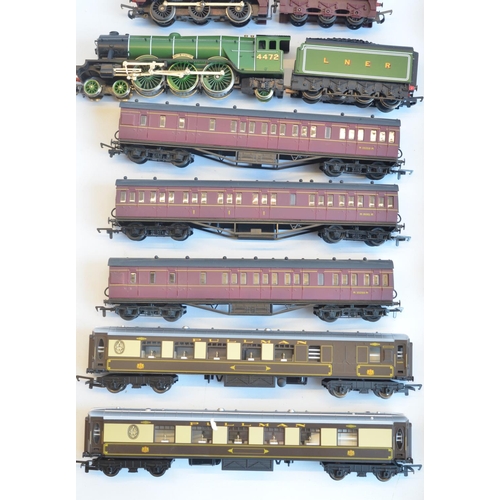 129 - Collection of unboxed OO gauge railway models to include Hornby Virgin HST with power and dummy cars... 